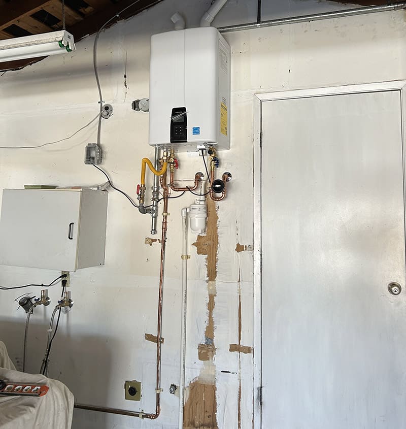 Wall-mounted tankless water heater after installation